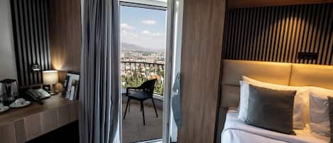 Deluxe Double Room, 1 Queen Bed, Balcony, City View | Premium bedding, minibar, desk, blackout drapes