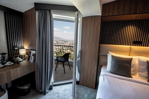 Deluxe Double Room, 1 Queen Bed, Balcony, City View | Premium bedding, minibar, desk, blackout drapes