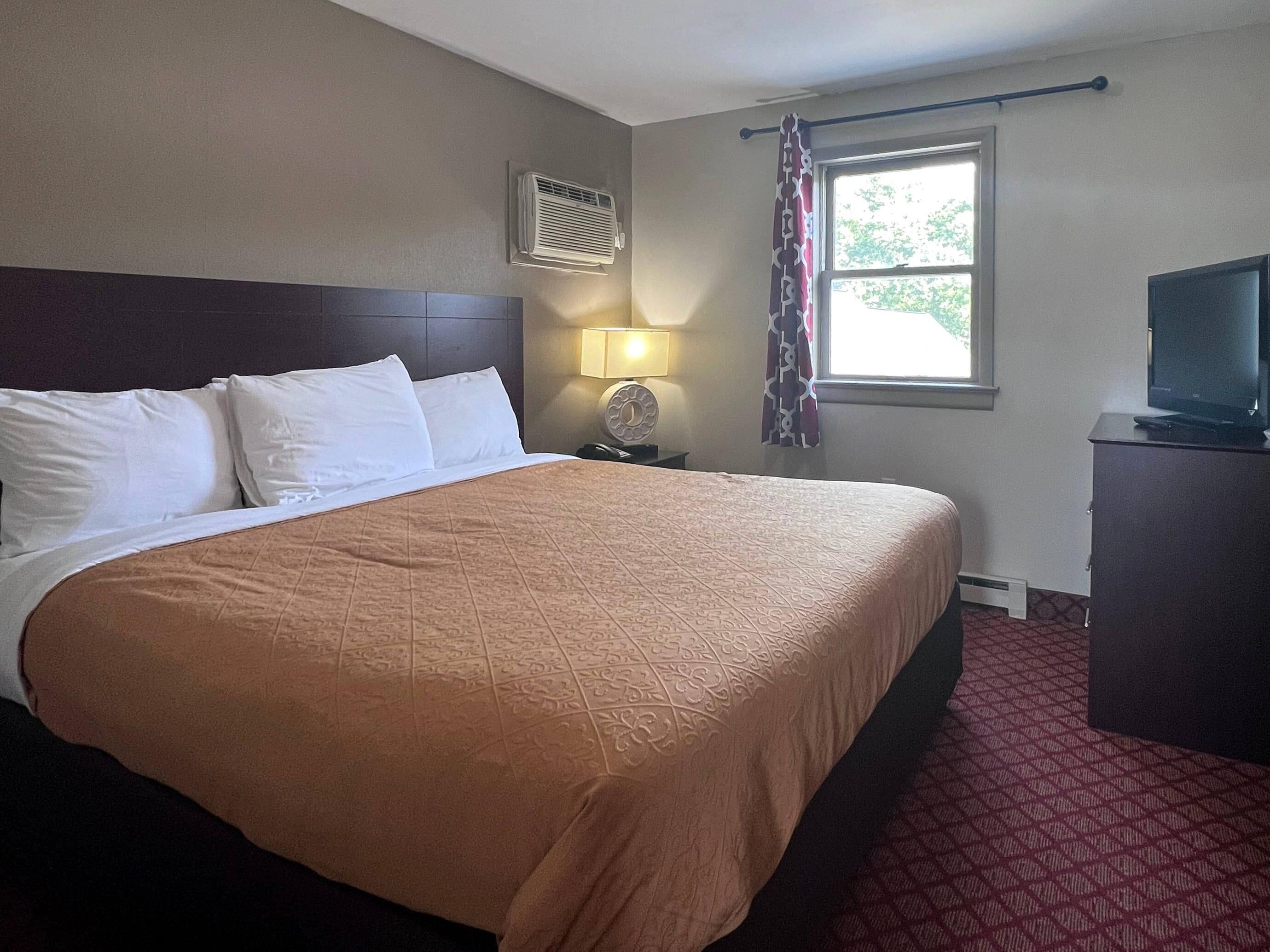 One King Bed, Two Double Beds,  Two Bedroom Suites, Non-Smoking | Desk, laptop workspace, iron/ironing board, free WiFi