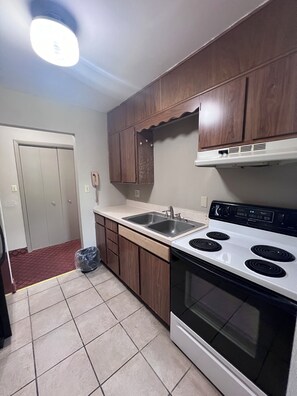 One King Bed, Two Double Beds, Two Bedroom Suites, Non-Smoking | Private kitchen | Mini-fridge, microwave, oven, coffee/tea maker