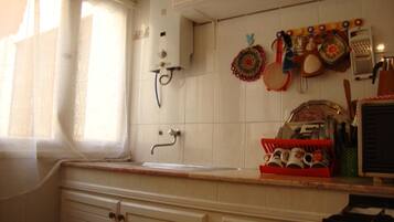 Apartment, 2 Bedrooms | Private kitchen | Full-size fridge, oven, stovetop, coffee/tea maker