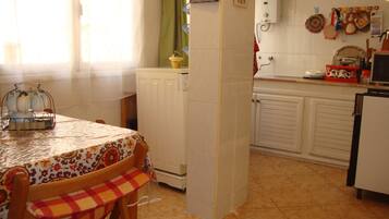 Apartment, 2 Bedrooms | Private kitchen | Full-size fridge, oven, stovetop, coffee/tea maker