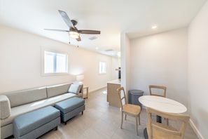 Deluxe Suite, 1 King Bed with Sofa bed, Kitchenette | Living area | 39-inch flat-screen TV with cable channels, TV
