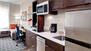 A compact kitchen with a microwave, coffee maker, and a dishwasher. - TownePlace Suites by Marriott Albany (Albany)