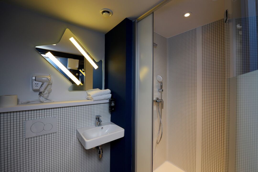 shower, eco-friendly toiletries, hair dryer, towels