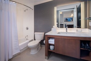 A modern bathroom with a bathtub, toilet, and sink. - Residence Inn by Marriott Baltimore at The Johns Hopkins Medical Campus (Baltimore)