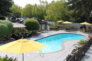 Outdoor pool, open 7:00 AM to 10:00 PM, pool umbrellas, pool loungers