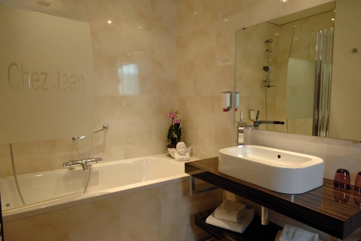 deep-soaking bathtub, free toiletries, hair dryer, towels