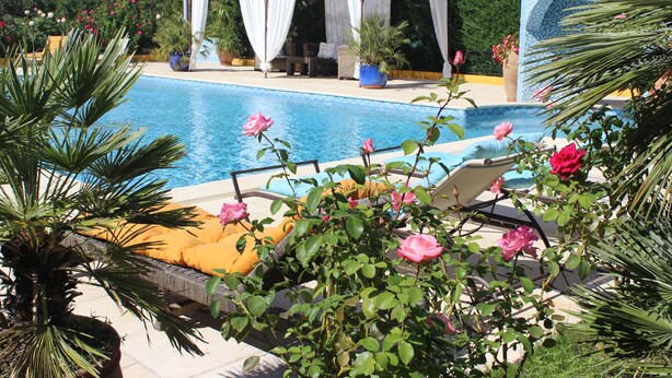 A pool area with lounge chairs and a gazebo. - Atypical house in the south of Provence near Avignon, 4 persons   (Carpentras)