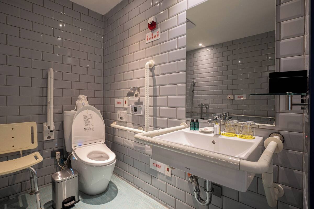 standard double room, mobility accessible | bathroom | hair dryer, electronic bidet, towels, shampoo