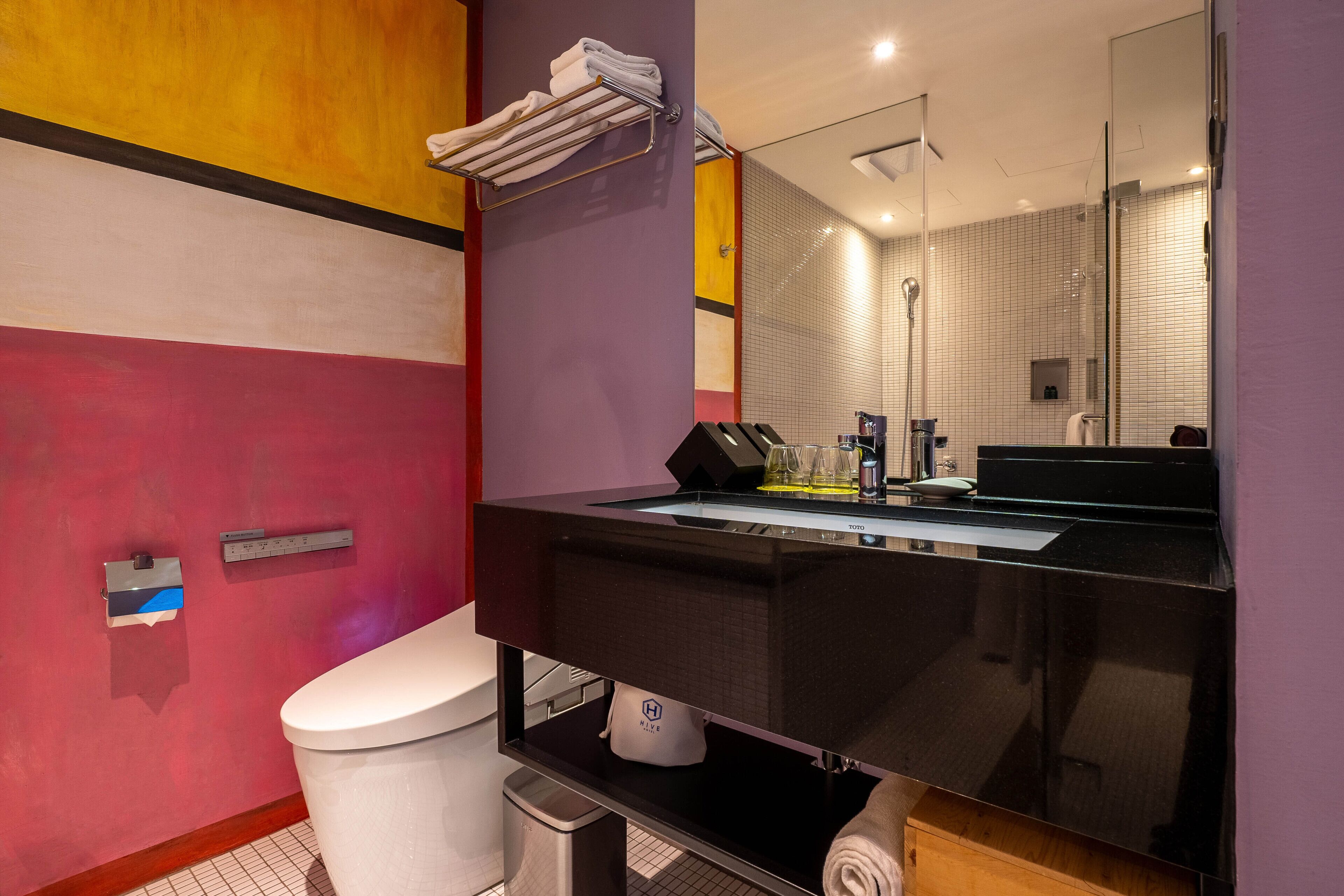 deluxe suite | bathroom | hair dryer, electronic bidet, towels, shampoo