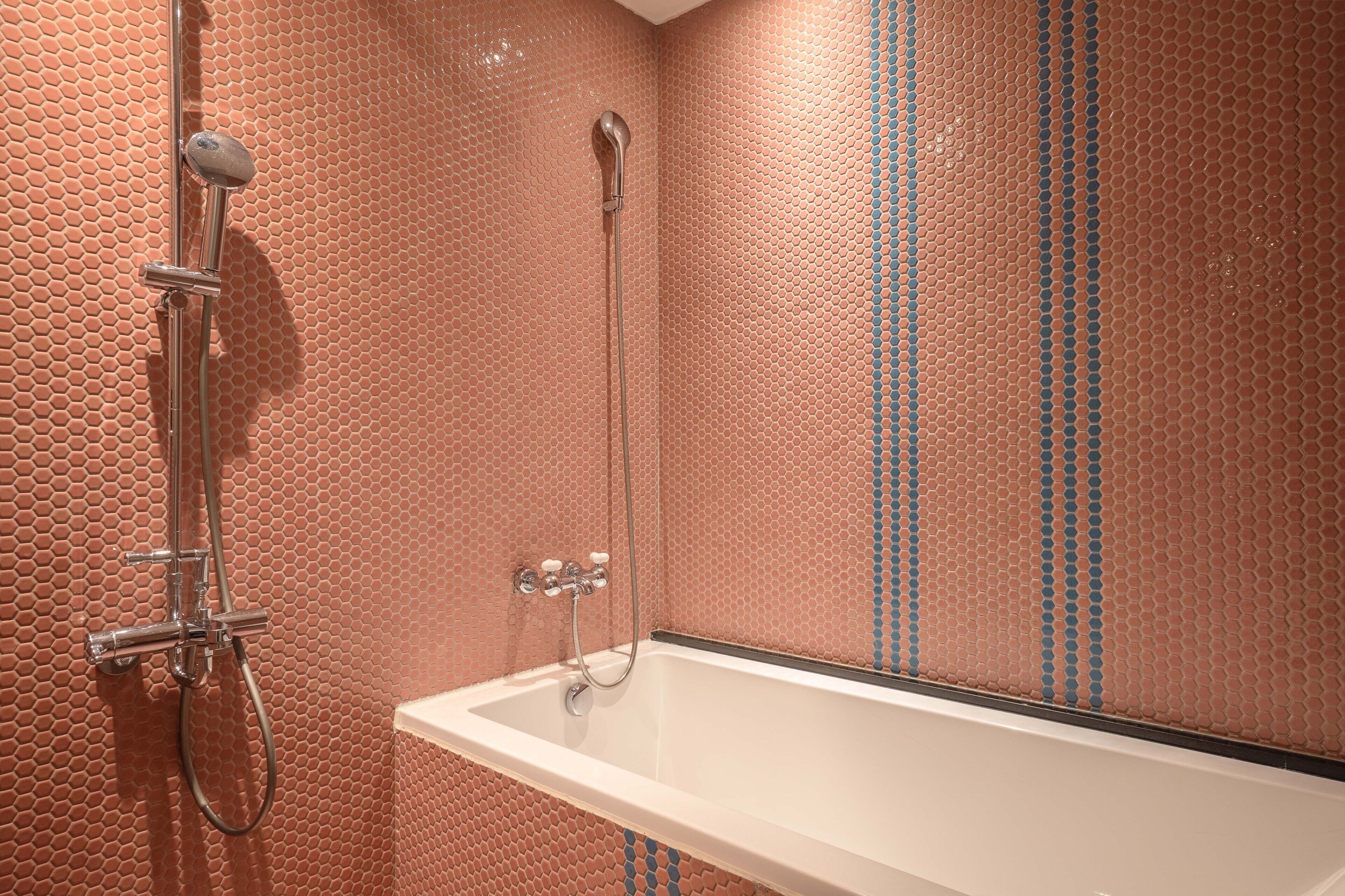 deluxe quadruple room | bathroom | hair dryer, electronic bidet, towels, shampoo