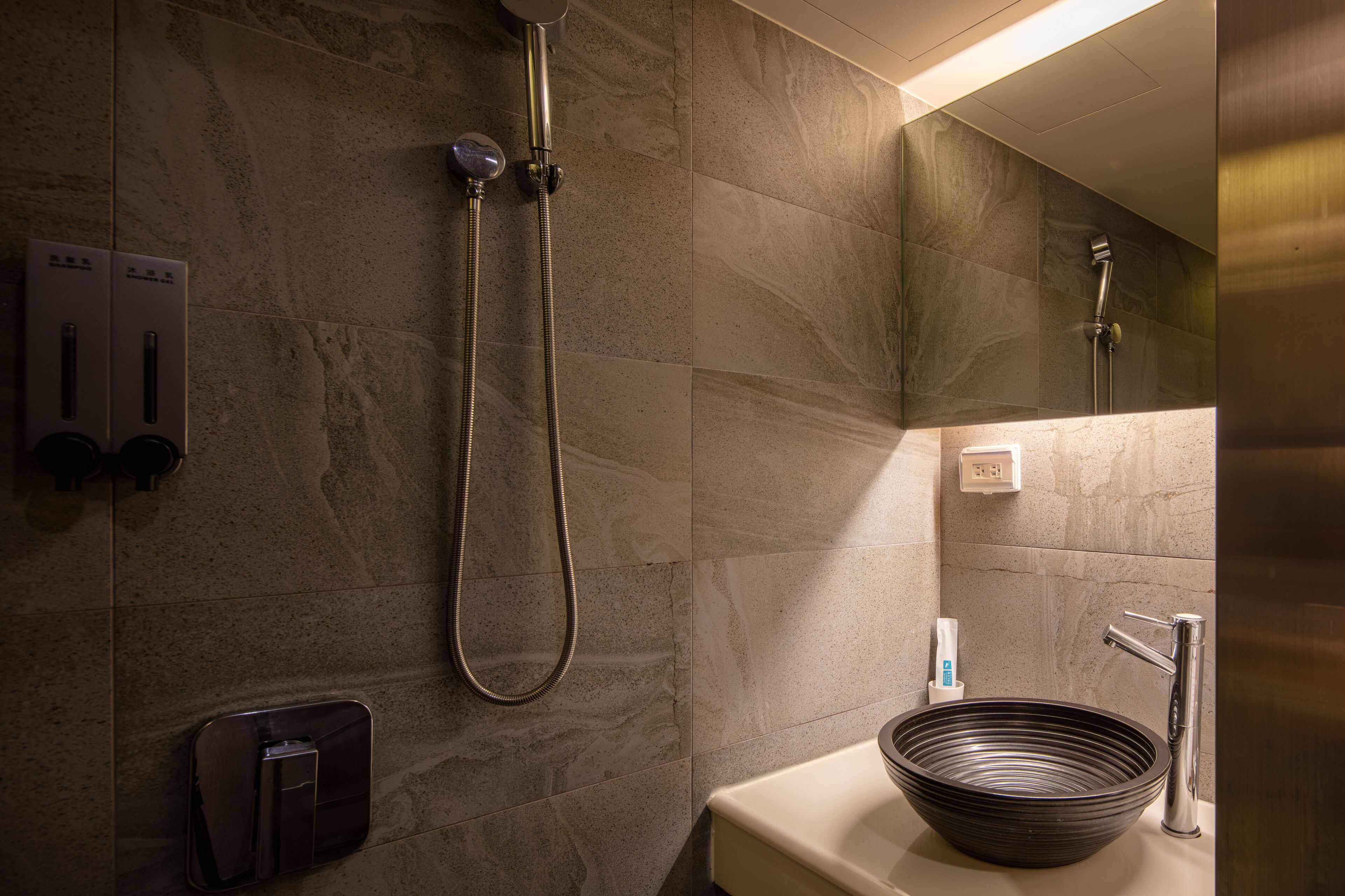 micro single room (no window) | bathroom | hair dryer, slippers, towels, shampoo