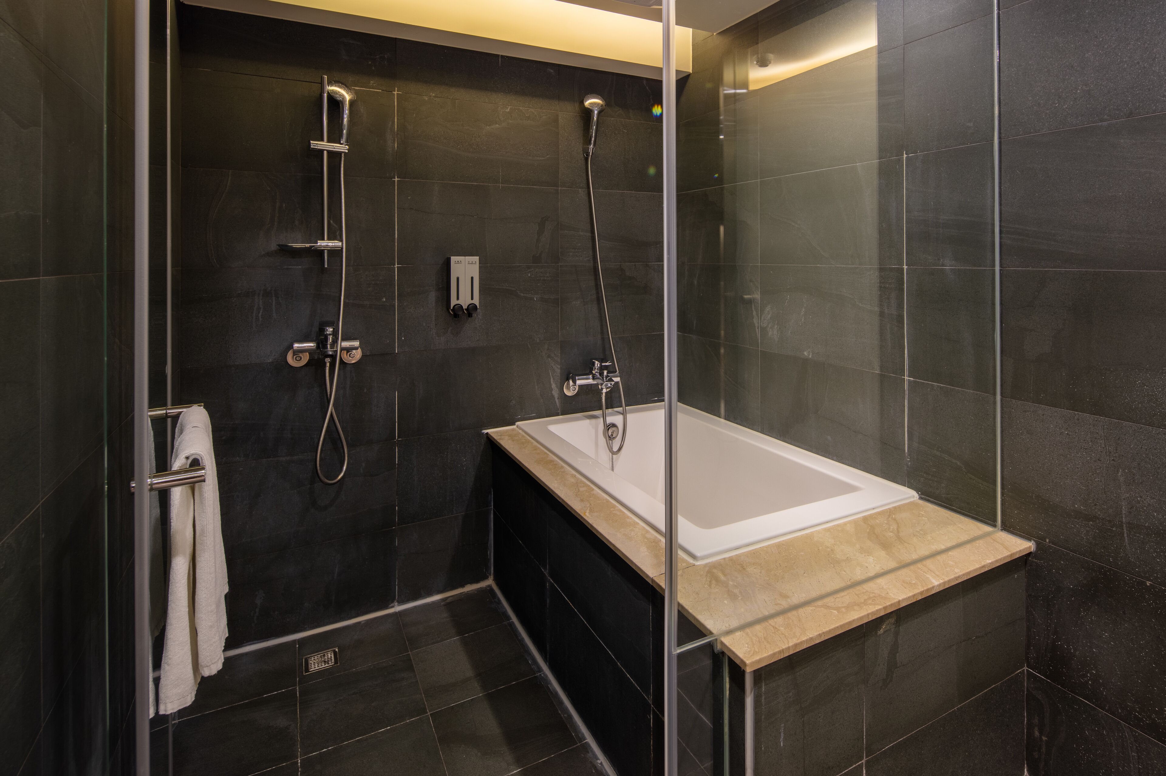 deluxe double room | bathroom | hair dryer, slippers, towels, shampoo