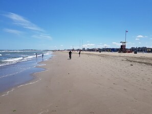 On the beach, sun-loungers, beach umbrellas, scuba diving