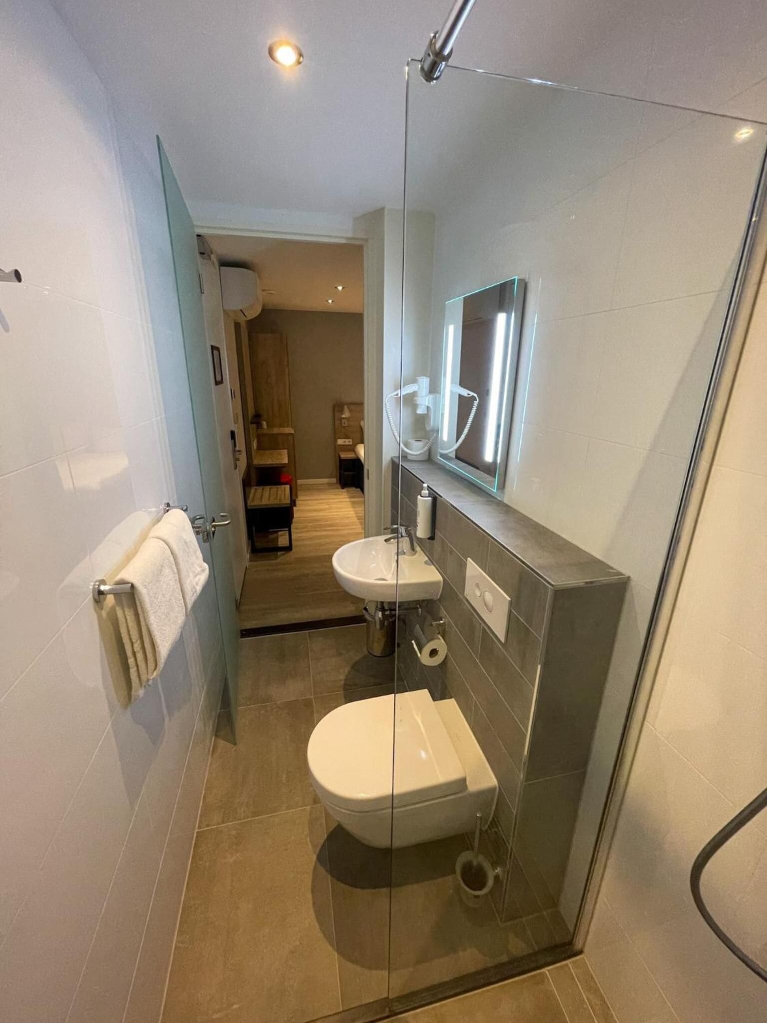 small double room without window | bathroom | shower, free toiletries, hair dryer, towels