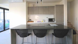 Deluxe Penthouse, 3 Bedrooms | Private kitchen | Coffee/tea maker, full-size fridge, microwave, oven - Holyguest - Harakevet 315 (Tel Aviv)