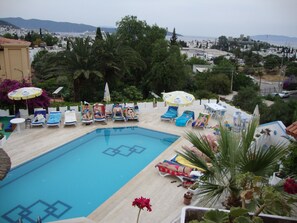 Outdoor pool, pool umbrellas, pool loungers
