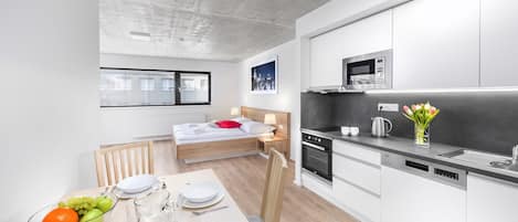 Studio Exécutif, 1 trÚs grand lit, cuisine, vue ville | Coin séjour