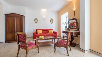 Junior Suite, 1 Queen Bed, Balcony | Living room | 32-inch Smart TV with satellite channels, TV