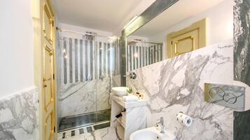 Junior Suite, 1 Queen Bed, Balcony | Bathroom | Shower, free toiletries, hair dryer, slippers