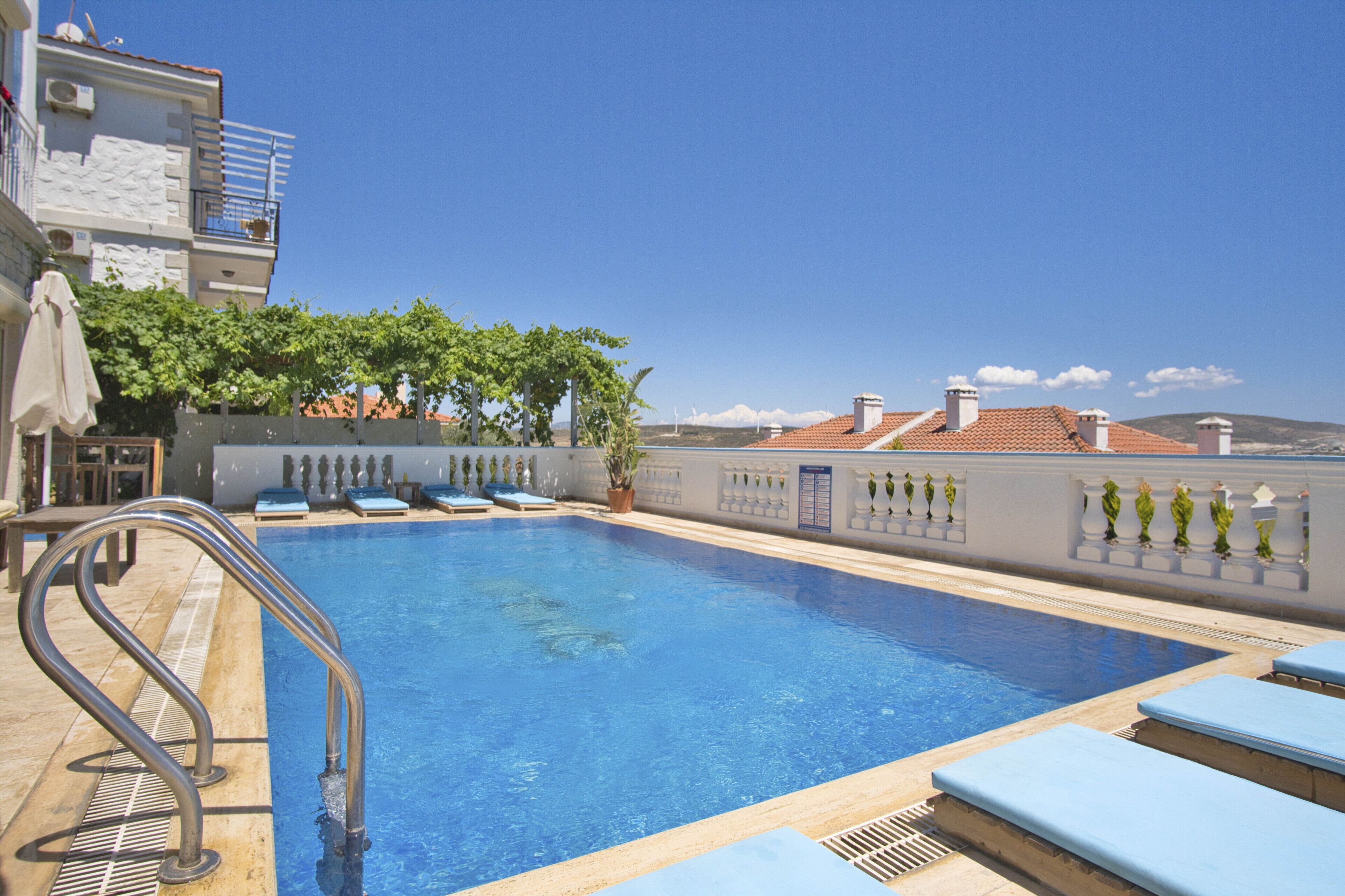 outdoor pool, pool umbrellas, pool loungers