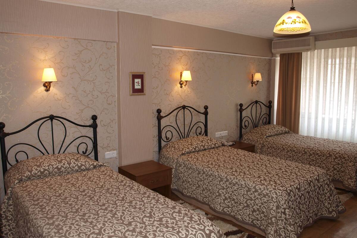 Standard Triple Room | Minibar, in-room safe, desk, blackout drapes