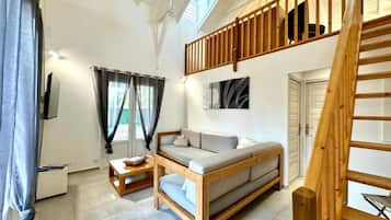 Villa St Barthélémy | Living area | 122-cm flat-screen TV with satellite channels