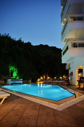 Seasonal outdoor pool, pool umbrellas, pool loungers