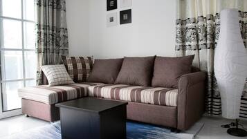 32-inch flat-screen TV with satellite channels, TV, Netflix