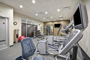 A gym with treadmills, exercise balls, and dumbbells. - Hilton Garden Inn Tulsa-Broken Arrow (Broken Arrow)