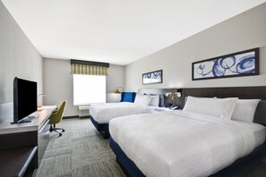 A hotel room with two beds, a desk with a flat-screen TV, a chair, and artwork on the walls. - Hilton Garden Inn Tulsa-Broken Arrow (Broken Arrow)