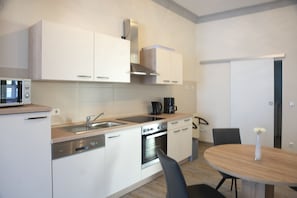 Fridge, stovetop, cookware/dishes/utensils
