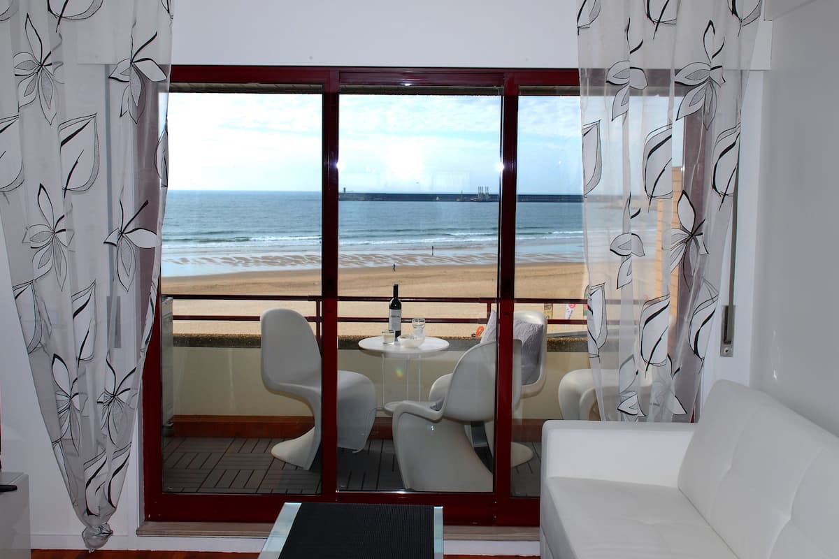 Apartment, 1 Bedroom, Sea View | Living room | Flat-screen TV