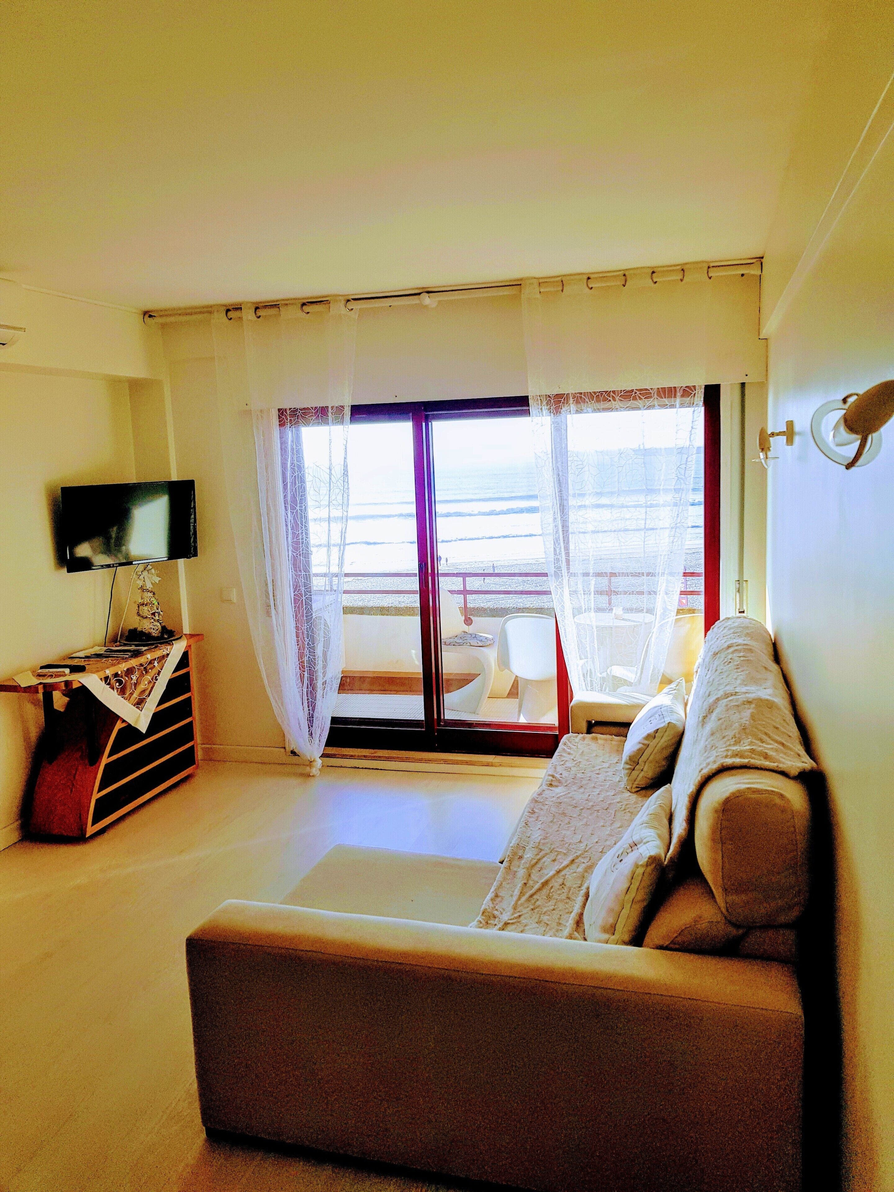 apartment, 1 bedroom, sea view | living room | flat-screen tv