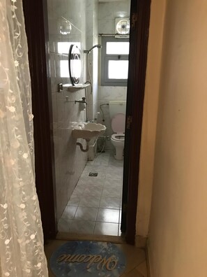 Combined shower/bathtub, jetted bath, hair dryer, bathrobes