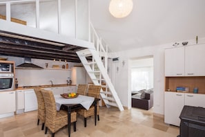 Kitchen, dining room and stairs to loft