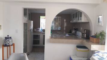 Fridge, microwave, stovetop, coffee/tea maker