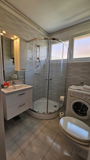 Shower, hair dryer, towels, soap