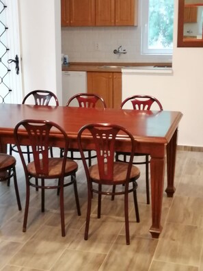 Enjoy meals in this dining area with a large table and six comfortable chairs.