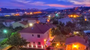 A residential area with houses, a swimming pool, and a well-lit garden. - Amazing villa near Split with private pool and playground!!!  (Žrnovnica)