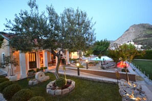 A residential property with a swimming pool, landscaped garden, and a view of a mountain. - Amazing villa near Split with private pool and playground!!! (Žrnovnica)
