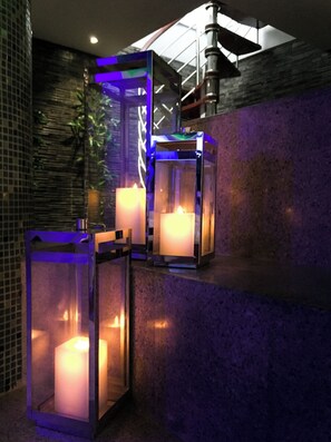 Experience a sophisticated atmosphere in our contemporary lobby, featuring a polished floor and elegant glass enclosure.