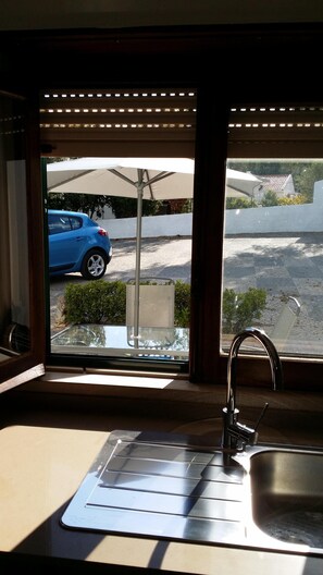 Enjoy a view of the street from the kitchen window, where you can watch the world go by.