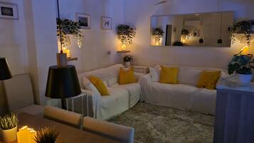 Älytelevisio, DVD-soitin, kirjoja, musiikkikirjasto