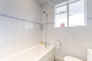 Combined shower/bathtub