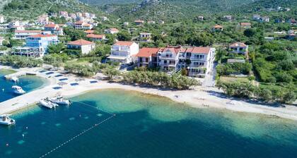 Luxury apartment literally on the beach - whirlpool and sauna