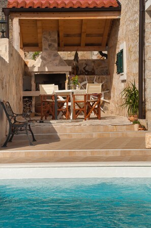 Outdoor pool, a heated pool - VILLA NIKOLA 100 YEAR OLD STONE RENOVATED VILLA WITH  HEATED POOL (Šolta)
