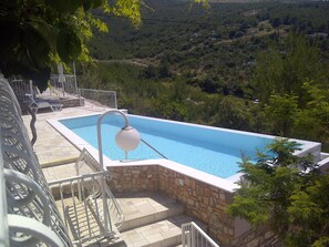 Outdoor pool, a heated pool - Two bedroom apartment with large daily room and infinity, heated, massage pool (Hvar)