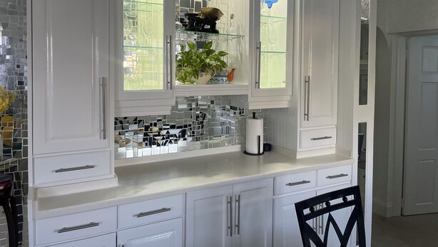 A kitchen with white cabinets, a glass backsplash, and a sink. - The Palms Areca-Attractive, Alluring and Aesthetically artistic (Bridgetown)